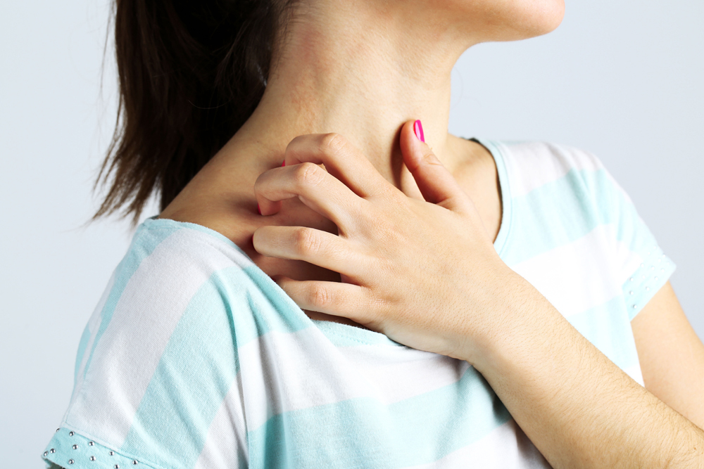 Female holding shoulder in pain